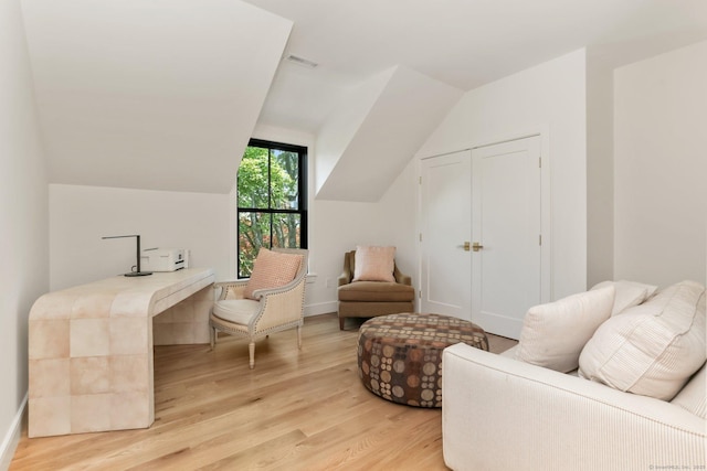 52 Garibaldi Ln, New Canaan, CT 06840 - sitting room with light wood-type flooring and vaulted ceiling