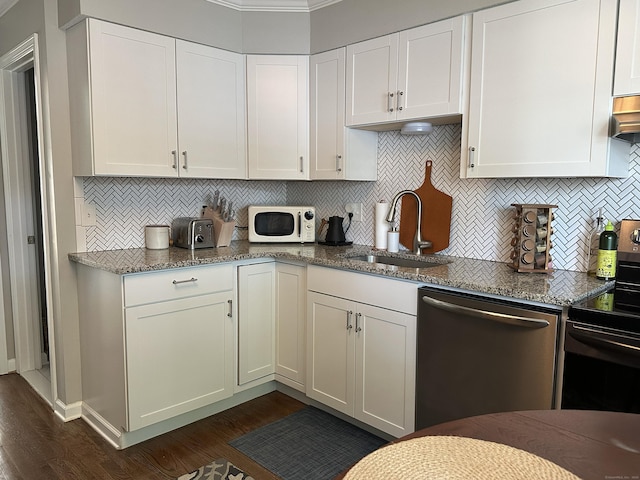 311 Georgetown Dr Unit 311, Glastonbury, CT 06033 - kitchen with appliances with stainless steel finishes, dark wood-style floors, tasteful backsplash, and white cabinetry
