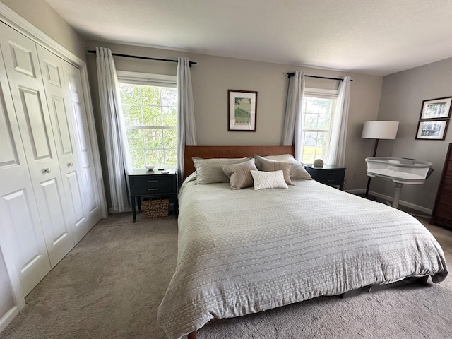 311 Georgetown Dr Unit 311, Glastonbury, CT 06033 - carpeted bedroom featuring a closet and baseboards
