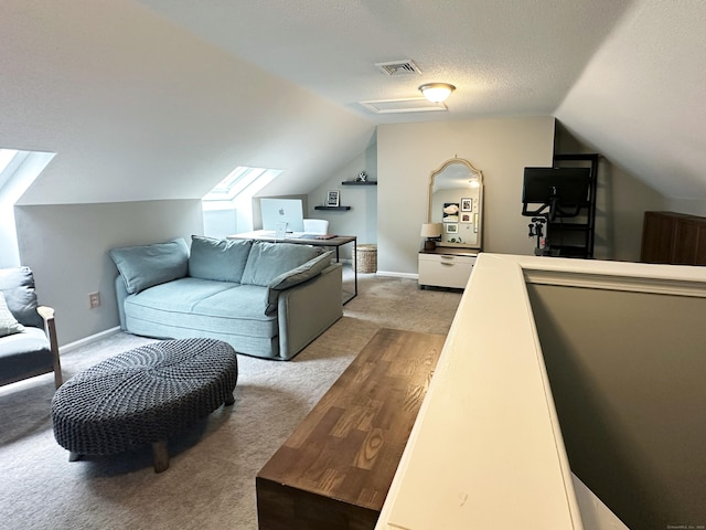 311 Georgetown Dr Unit 311, Glastonbury, CT 06033 - living room featuring light carpet, lofted ceiling, a skylight, and a textured ceiling