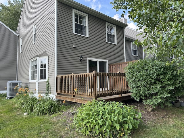 311 Georgetown Dr Unit 311, Glastonbury, CT 06033 - rear view of property featuring a wooden deck and a chimney