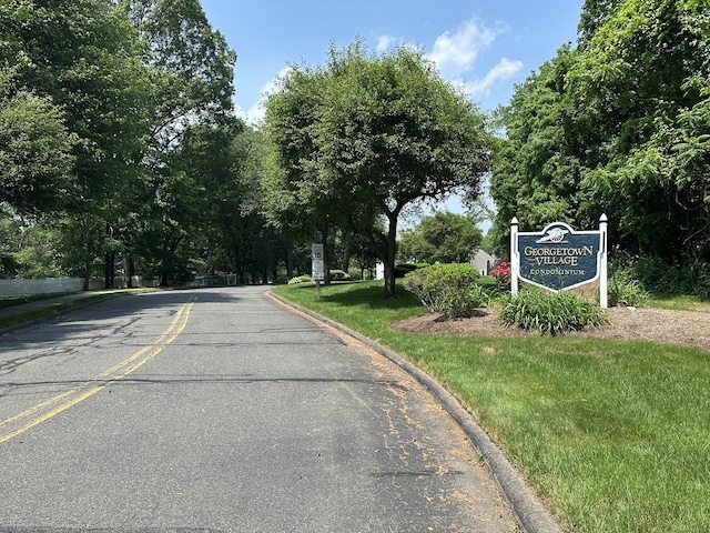 311 Georgetown Dr Unit 311, Glastonbury, CT 06033 - view of asphalt road featuring curbs