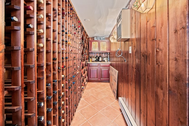 430 Cook Hill Rd, Cheshire, CT 06410 - wine cellar featuring baseboard heating, light tile patterned flooring, and wood walls