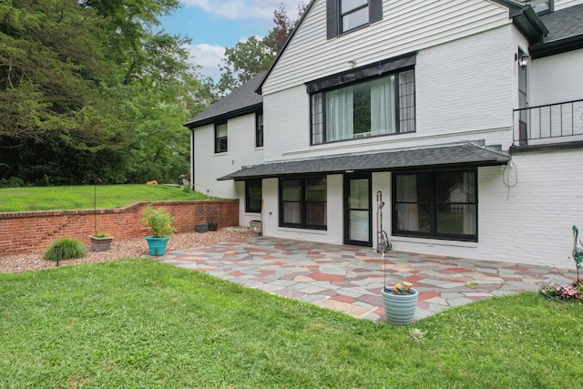430 Cook Hill Rd, Cheshire, CT 06410 - back of house featuring a yard, a patio, brick siding, and roof with shingles