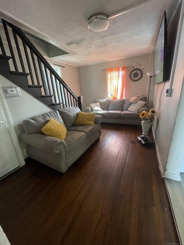 104 Terrace Ave, West Haven, CT 06516 - living room with a textured ceiling, dark wood finished floors, and stairs