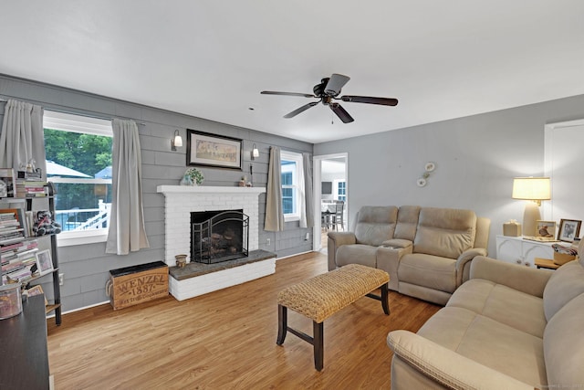 24 Saley Rd, Milford, CT 06460 - living area with wood finished floors, a fireplace, and a ceiling fan