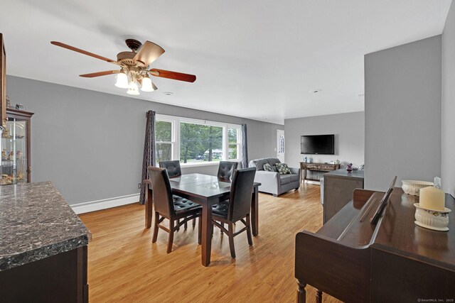 24 Saley Rd, Milford, CT 06460 - dining area featuring a baseboard radiator, light wood-type flooring, and ceiling fan