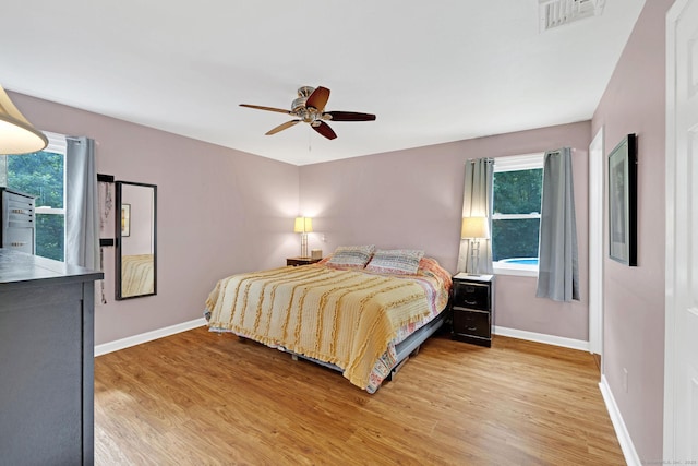 24 Saley Rd, Milford, CT 06460 - bedroom with multiple windows, light wood-style floors, and ceiling fan