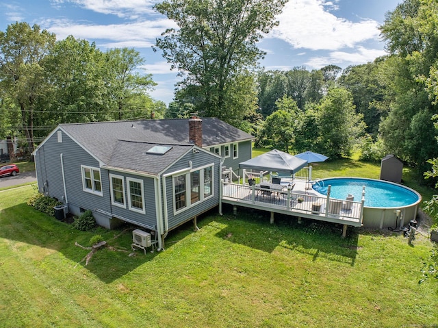 24 Saley Rd, Milford, CT 06460 - back of house with a shingled roof, a chimney, an outdoor pool, a yard, and a deck