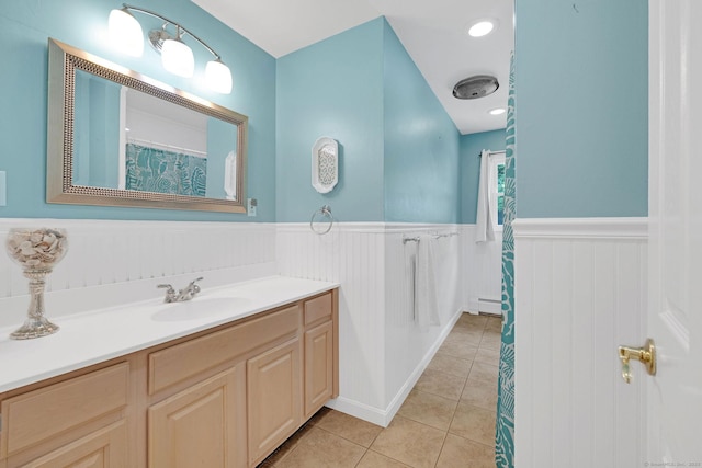 24 Saley Rd, Milford, CT 06460 - full bath featuring a wainscoted wall, vanity, a baseboard radiator, tile patterned floors, and a shower with curtain
