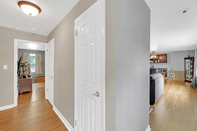 24 Saley Rd, Milford, CT 06460 - hallway with light wood-style flooring and baseboards
