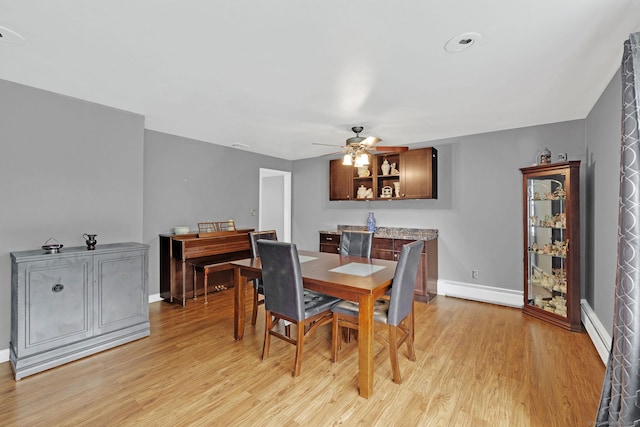 24 Saley Rd, Milford, CT 06460 - dining space with a baseboard radiator, light wood-style flooring, and ceiling fan