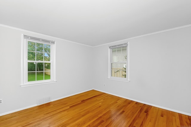 103 Colonial Dr, Fairfield, CT 06824 - empty room with wood finished floors and crown molding