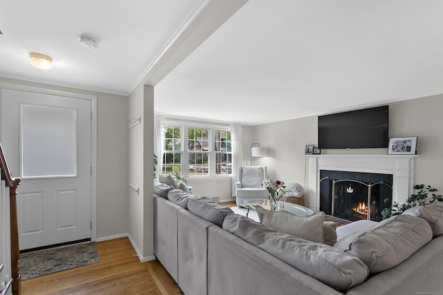 103 Colonial Dr, Fairfield, CT 06824 - living room with a fireplace, wood finished floors, and crown molding