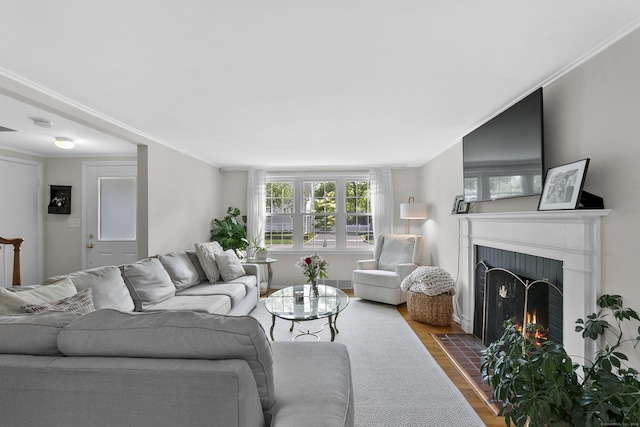 103 Colonial Dr, Fairfield, CT 06824 - living area featuring dark wood-type flooring, a fireplace, and crown molding