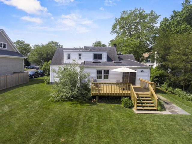 103 Colonial Dr, Fairfield, CT 06824 - back of house featuring a wooden deck, a yard, and a chimney