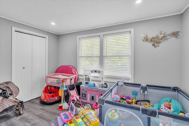 202A Hartford Pike, Foster, Rhode Island, RI 02825 - rec room with wood finished floors, ornamental molding, recessed lighting, and a textured ceiling