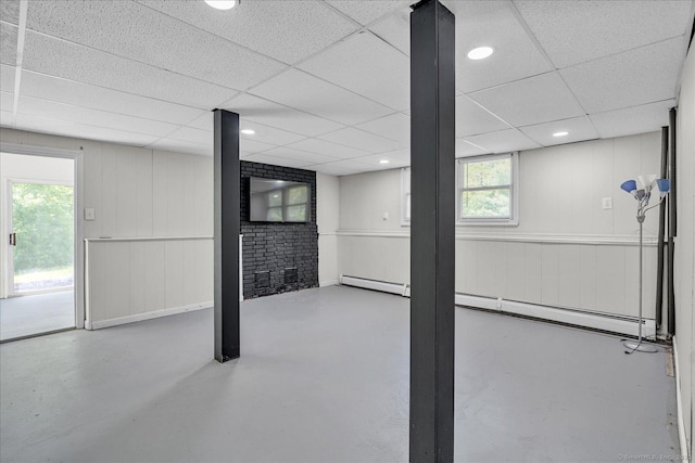 202A Hartford Pike, Foster, Rhode Island, RI 02825 - below grade area featuring plenty of natural light, a paneled ceiling, and a baseboard radiator