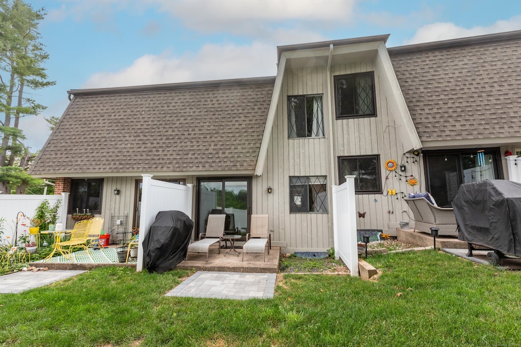 253 W St Apt B, Southington, CT 06479 - back of property featuring roof with shingles and a patio area