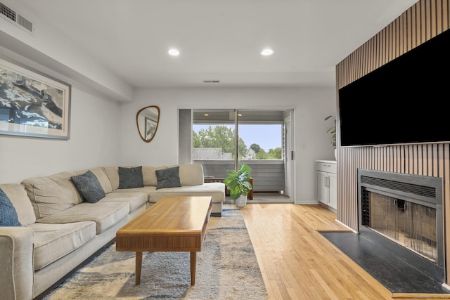 267 Melba St Apt D10, Milford, CT 06460 - living room featuring light wood-type flooring, recessed lighting, and a fireplace with flush hearth