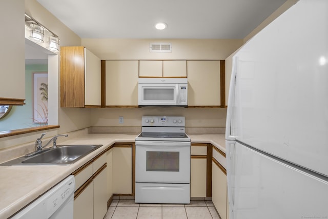 267 Melba St Apt D10, Milford, CT 06460 - kitchen with white appliances, light countertops, light tile patterned floors, and recessed lighting