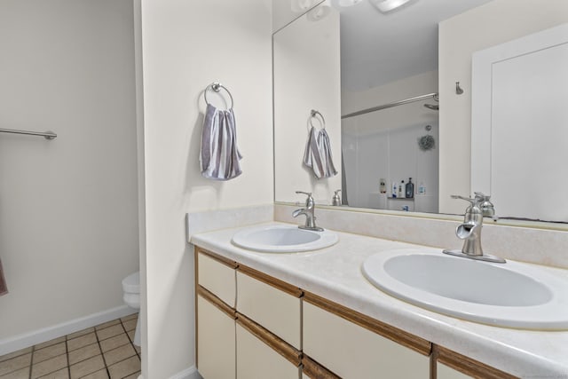 267 Melba St Apt D10, Milford, CT 06460 - bathroom with tile patterned floors, double vanity, and a shower