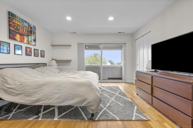 267 Melba St Apt D10, Milford, CT 06460 - bedroom featuring access to outside, light wood-type flooring, and recessed lighting