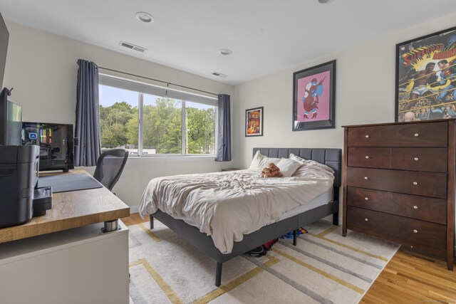 267 Melba St Apt D10, Milford, CT 06460 - bedroom with light wood-style flooring and an office area