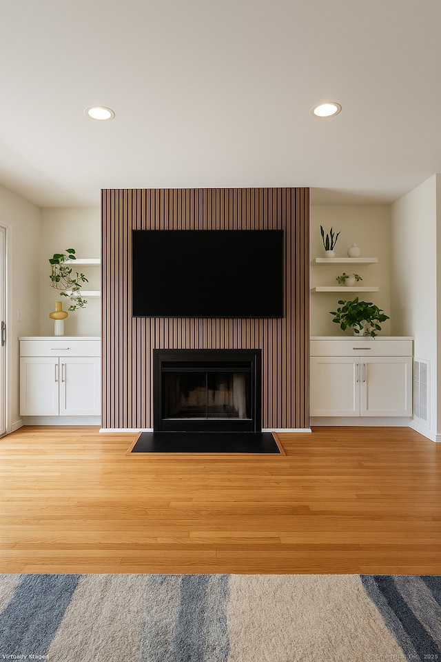267 Melba St Apt D10, Milford, CT 06460 - detailed view of wood finished floors, recessed lighting, and a fireplace with flush hearth