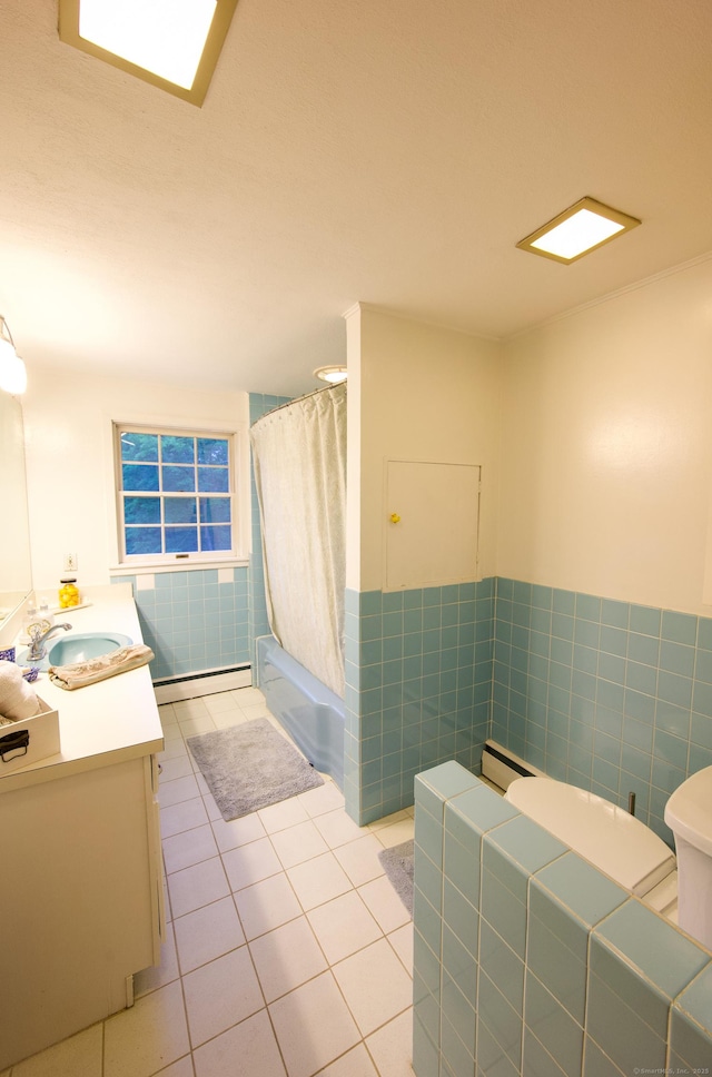 593 Northfield Rd, Watertown, CT 06795 - full bathroom with vanity, tile patterned flooring, a baseboard radiator, shower / tub combo, and a wainscoted wall