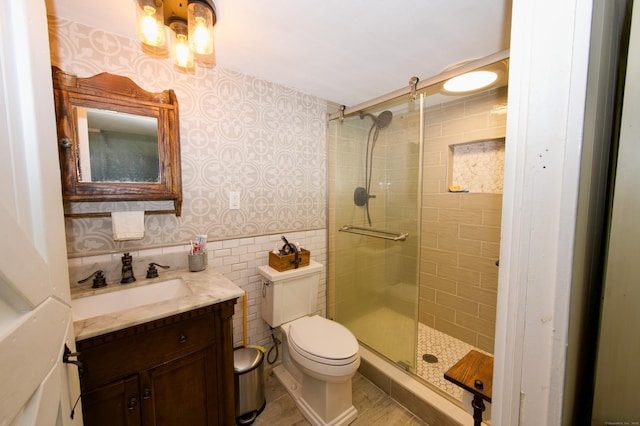 593 Northfield Rd, Watertown, CT 06795 - bathroom with vanity, a stall shower, and wallpapered walls