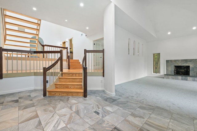 202 High Wood Dr, Glastonbury, CT 06073 - stairway with vaulted ceiling, recessed lighting, carpet floors, and a premium fireplace