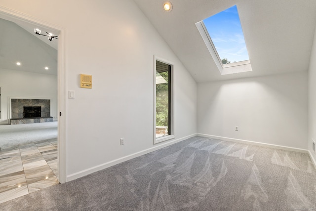202 High Wood Dr, Glastonbury, CT 06073 - bonus room featuring vaulted ceiling, a skylight, a premium fireplace, carpet floors, and recessed lighting