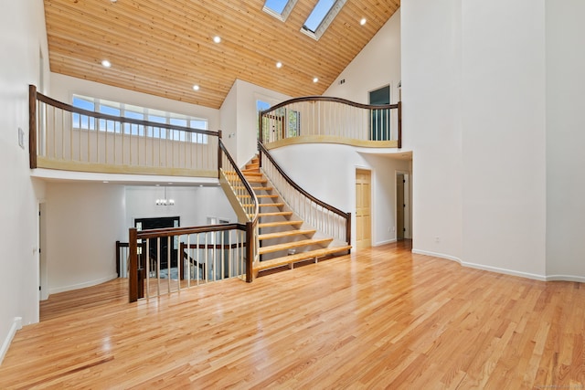 202 High Wood Dr, Glastonbury, CT 06073 - staircase featuring high vaulted ceiling, a skylight, wood finished floors, recessed lighting, and wooden ceiling