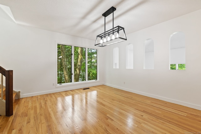 202 High Wood Dr, Glastonbury, CT 06073 - empty room featuring light wood-style flooring and stairway