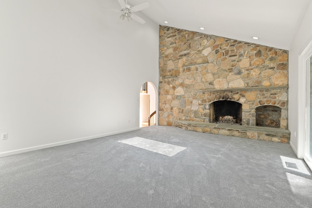 202 High Wood Dr, Glastonbury, CT 06073 - unfurnished living room featuring a ceiling fan, carpet floors, a stone fireplace, and high vaulted ceiling