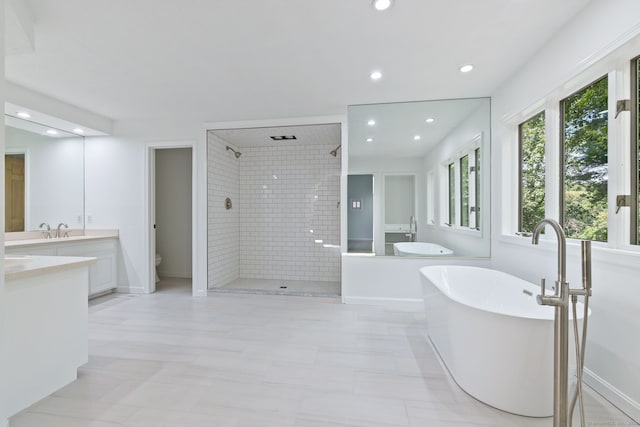 202 High Wood Dr, Glastonbury, CT 06073 - bathroom with a tile shower, vanity, a freestanding bath, and recessed lighting