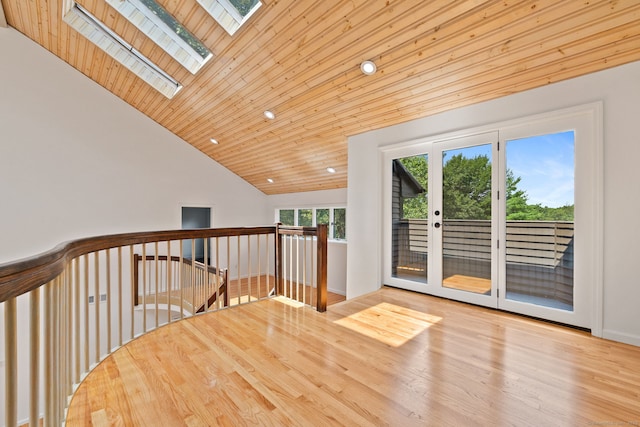 202 High Wood Dr, Glastonbury, CT 06073 - hall with a skylight, vaulted ceiling, an upstairs landing, wood finished floors, and wood ceiling