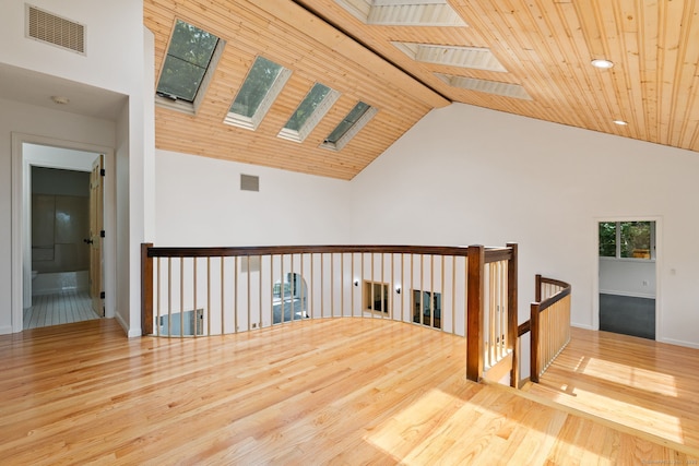 202 High Wood Dr, Glastonbury, CT 06073 - spare room featuring a skylight, wood finished floors, wood ceiling, and high vaulted ceiling