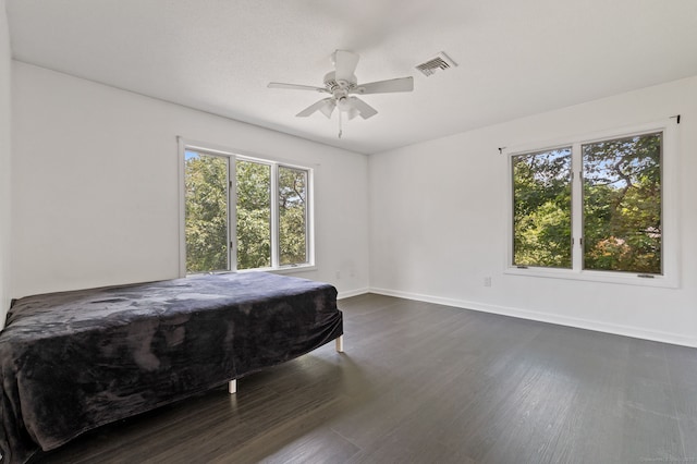 202 High Wood Dr, Glastonbury, CT 06073 - bedroom featuring multiple windows, dark wood-style flooring, and ceiling fan