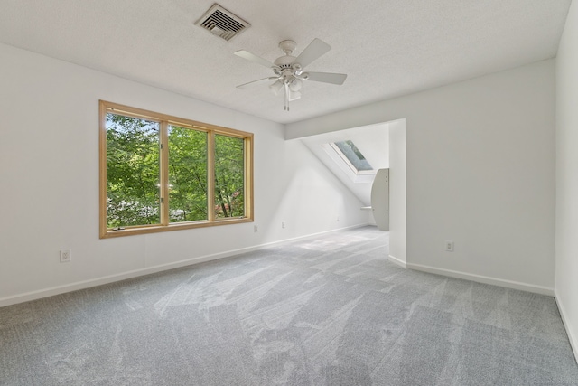 202 High Wood Dr, Glastonbury, CT 06073 - spare room with a skylight, carpet flooring, a ceiling fan, and a textured ceiling