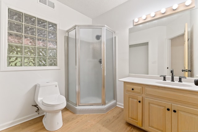 202 High Wood Dr, Glastonbury, CT 06073 - full bath with a stall shower, wood finished floors, vanity, and a textured ceiling