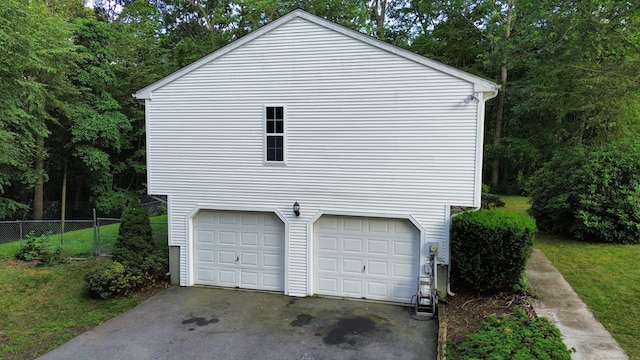 19 Peach Tree Hill Ave, Ledyard, CT 06339 - view of side of home with an attached garage and driveway
