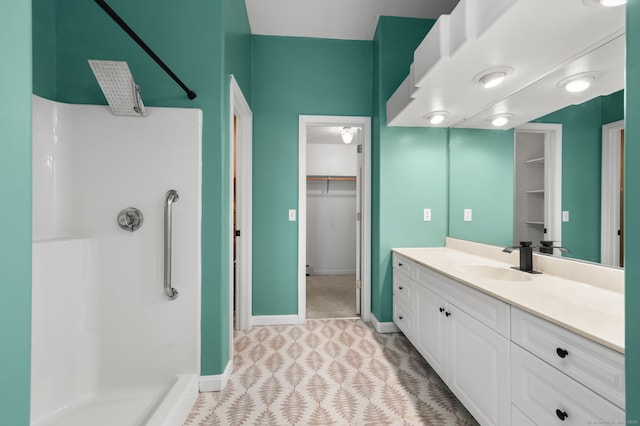 19 Peach Tree Hill Ave, Ledyard, CT 06339 - bathroom with vanity, a shower, and a walk in closet