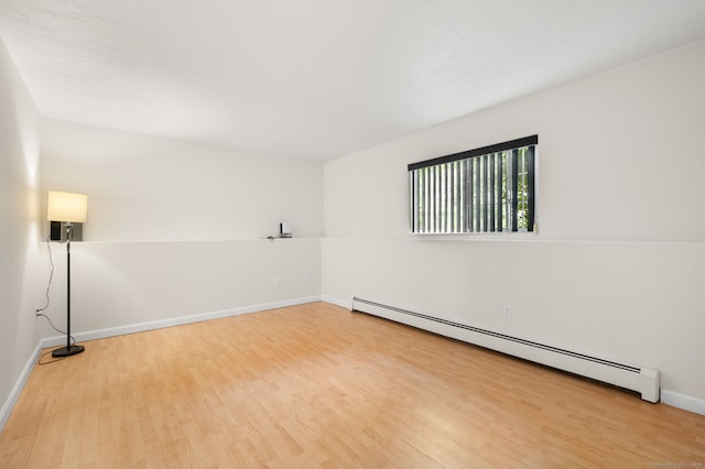 19 Peach Tree Hill Ave, Ledyard, CT 06339 - empty room with a baseboard heating unit and light wood-style floors