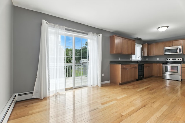 221 Griffin Rd, Suffield, CT 06093 - kitchen with stainless steel appliances, dark countertops, light wood-type flooring, a baseboard heating unit, and brown cabinets