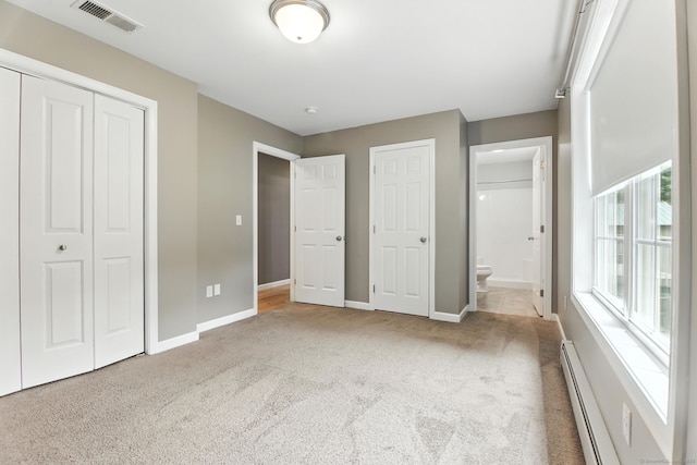 221 Griffin Rd, Suffield, CT 06093 - unfurnished bedroom featuring baseboard heating, carpet, ensuite bathroom, and a closet