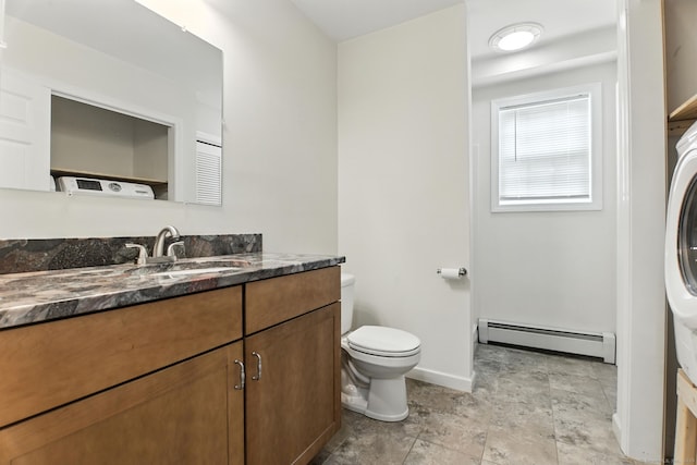 221 Griffin Rd, Suffield, CT 06093 - bathroom with a baseboard heating unit, vanity, and stone finish flooring
