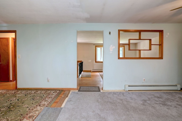 68 Highland Ave, East Haven, CT 06513 - empty room featuring a baseboard heating unit and wood finished floors