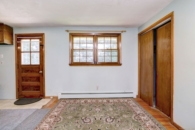 68 Highland Ave, East Haven, CT 06513 - entryway featuring a baseboard radiator and light wood-style flooring